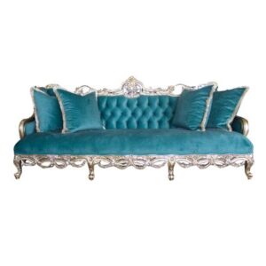 "A highly decorative, antique-style 3-seater sofa featuring an intricately carved silver-toned frame with cabriole legs and a detailed central crest. The sofa is upholstered in bright teal velvet with a deep button-tufted backrest and a single smooth seat cushion, accessorized with four matching fringed throw pillows against a plain white background
